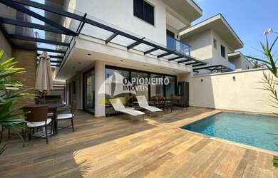 Imagem: A casa em condomínio e possui 4 Dormitórios, Suítes, 5 Banheiros