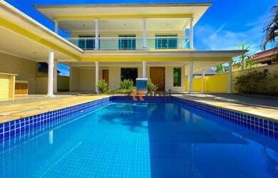 Imagem: A casa possui 4 Dormitórios, 5 Banheiros, 5 Vagas na garagem