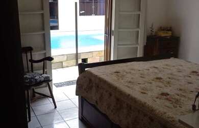 Imagem: A casa possui 3 Dormitórios, 4 Banheiros, 3 Vagas na garagem