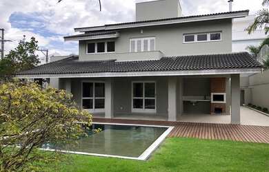 Imagem: A casa em condomínio possui 4 Dormitórios, 5 Banheiros, 4