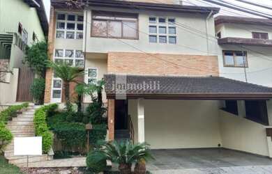 Imagem: A casa possui 3 Dormitórios, 5 Banheiros, 4 Vagas na garagem