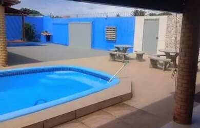 Imagem: A casa possui 3 Dormitórios, 5 Vagas na garagem e está localizado