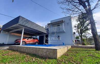 Imagem: A casa possui 3 Dormitórios, 3 Banheiros, 3 Vagas na garagem