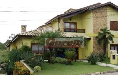 Imagem: A casa em condomínio possui 3 Dormitórios, 3 Banheiros, 5