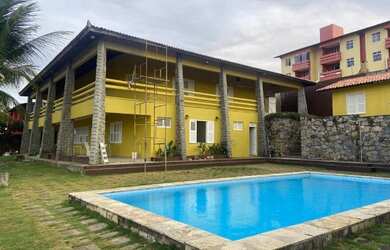 Imagem: A casa possui 5 Dormitórios, 5 Banheiros, 5 Vagas na garagem