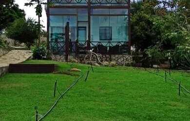 Imagem: A casa possui 4 Dormitórios, 4 Vagas na garagem e está localizado