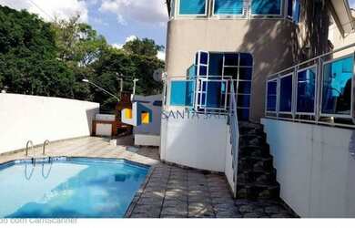 Imagem: A casa possui 4 Dormitórios, 4 Banheiros, 5 Vagas na garagem