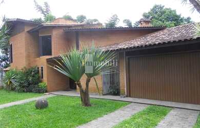 Imagem: A casa possui 3 Dormitórios, 4 Banheiros, 4 Vagas na garagem