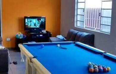 Imagem: A casa possui 3 Dormitórios, 4 Banheiros, 3 Vagas na garagem