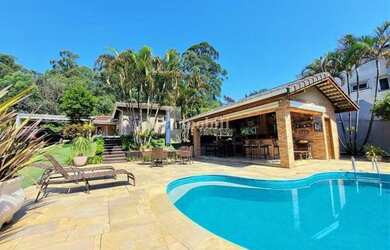 Imagem: A casa possui 5 Dormitórios, 5 Banheiros, 5 Vagas na garagem