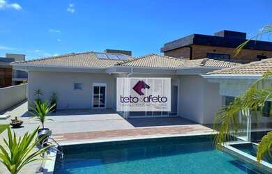 Imagem: A casa possui 4 Dormitórios, 5 Banheiros, 5 Vagas na garagem