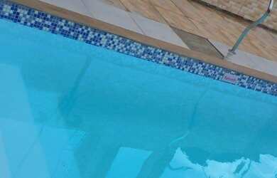 Imagem: A casa possui 2 Dormitórios, 3 Vagas na garagem e está localizado