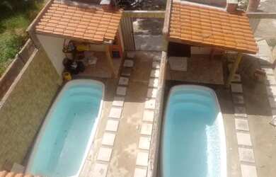 Imagem: A casa possui 3 Dormitórios, 3 Vagas na garagem e está localizado