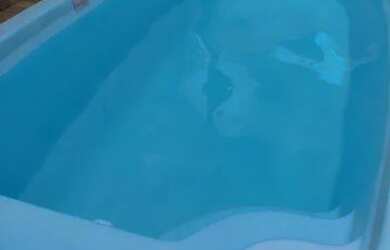 Imagem: A casa possui 2 Dormitórios, 3 Banheiros, 4 Vagas na garagem