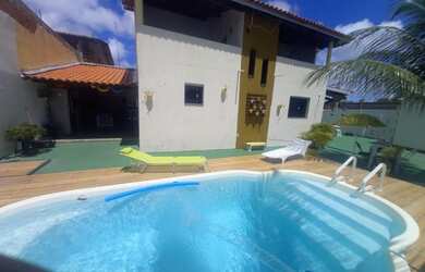 Imagem: A casa possui 5 Dormitórios, 3 Banheiros, 3 Vagas na garagem