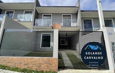 Imagem: A casa possui 3 Dormitórios, 3 Banheiros, 2 Vagas na garagem