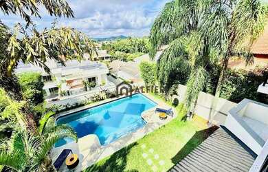 Imagem: A casa em condomínio possui 4 Dormitórios, 5 Banheiros, 5