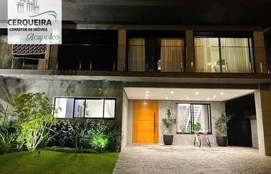 Imagem: A casa possui 5 Dormitórios, 5 Banheiros, 4 Vagas na garagem