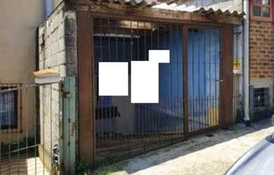 Imagem: A casa possui 2 Dormitórios, 1 Banheiro, 1 Vaga na garagem