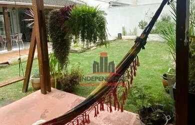 Imagem: A casa em condomínio possui 4 Dormitórios, 4 Banheiros, 3