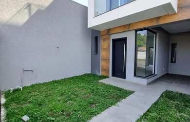 Imagem: A casa possui 3 Dormitórios, 3 Banheiros, 2 Vagas na garagem