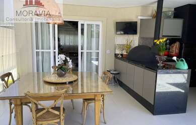 Imagem: A casa em condomínio possui 4 Dormitórios, 5 Banheiros, 4