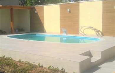 Imagem: A casa possui 3 Dormitórios, 3 Banheiros, 3 Vagas na garagem