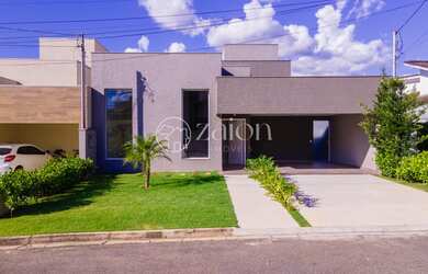 Imagem: A casa possui 3 Dormitórios, 5 Banheiros, 4 Vagas na garagem