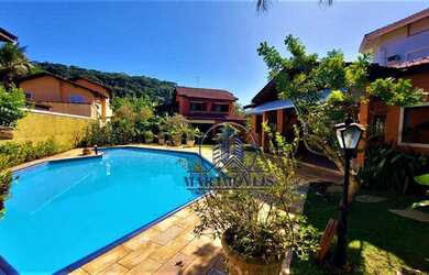 Imagem: A casa em condomínio possui 5 Dormitórios, 5 Banheiros, 4