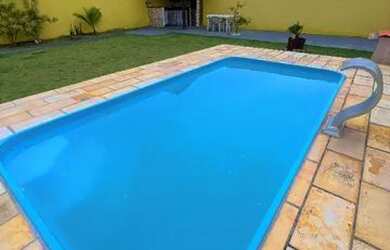 Imagem: A casa possui 2 Dormitórios, 3 Banheiros, 4 Vagas na garagem