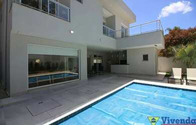 Imagem: A casa possui 4 Dormitórios, 5 Banheiros, 5 Vagas na garagem