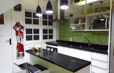 Imagem: A casa possui 3 Dormitórios, 3 Banheiros, 2 Vagas na garagem