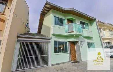 Imagem: A casa possui 3 Dormitórios, 3 Banheiros, 2 Vagas na garagem