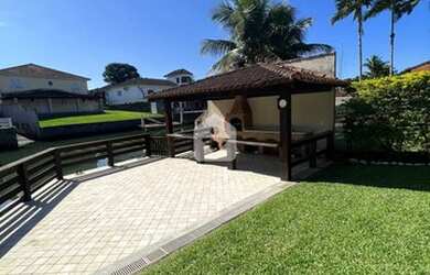 Imagem: A casa possui 4 Dormitórios, 4 Banheiros, 4 Vagas na garagem