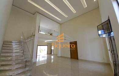 Imagem: A casa possui 4 Dormitórios, 5 Banheiros, 4 Vagas na garagem