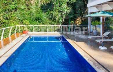 Imagem: A casa possui 5 Dormitórios, 5 Banheiros, 5 Vagas na garagem