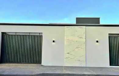 Imagem: A casa possui 3 Dormitórios, 2 Banheiros, 2 Vagas na garagem