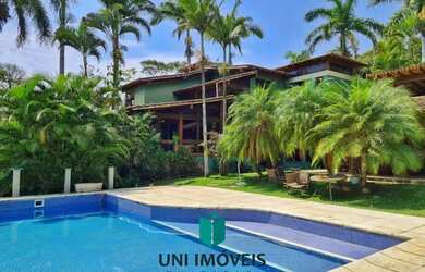 Imagem: A casa possui 5 Dormitórios, 4 Banheiros, 5 Vagas na garagem