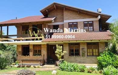 Imagem: A casa em condomínio possui 4 Dormitórios, 5 Banheiros, 4