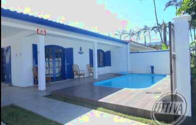 Imagem: A casa possui 3 Dormitórios, 3 Banheiros, 5 Vagas na garagem