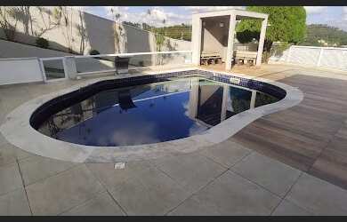 Imagem: A casa em condomínio possui 4 Dormitórios, 5 Banheiros, 5