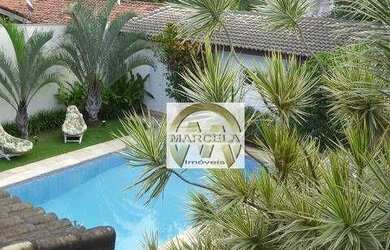 Imagem: A casa possui 4 Dormitórios, 4 Banheiros, 5 Vagas na garagem