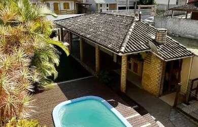 Imagem: A casa à venda possui 4 Dormitórios, 4 Banheiros, 3 Vagas