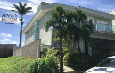 Imagem: A casa possui 4 Dormitórios, 5 Banheiros, 5 Vagas na garagem