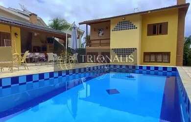 Imagem: A casa possui 3 Dormitórios, 3 Banheiros, 3 Vagas na garagem