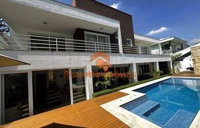 Imagem: A casa em condomínio possui 4 Dormitórios, 5 Banheiros, 4