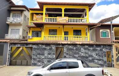 Imagem: A casa possui 5 Dormitórios, 4 Banheiros, 2 Vagas na garagem