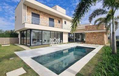 Imagem: A casa em condomínio possui 4 Dormitórios, 5 Banheiros, 331m²