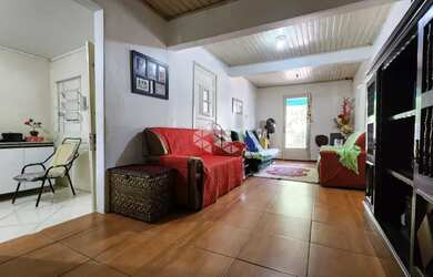 Imagem: A casa possui 3 Dormitórios, 1 Banheiro, 1 Vaga na garagem