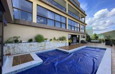 Imagem: A casa em condomínio possui 5 Dormitórios, 5 Banheiros, 3